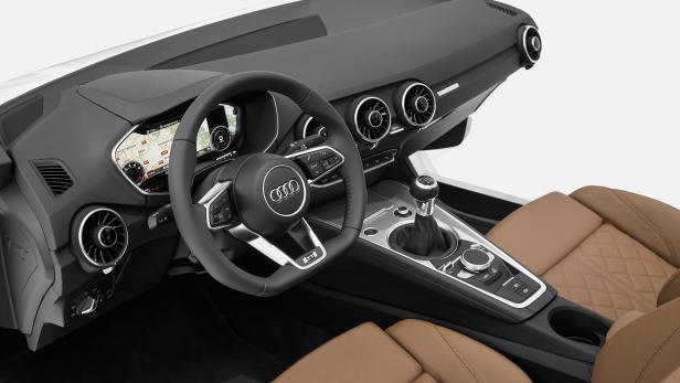 Innenraum eines Audi TT mit braunen Ledersitzen und manuellem Schaltgetriebe.