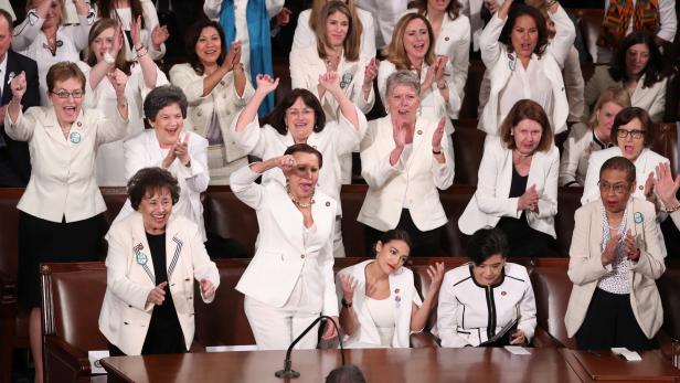 Democratic female members of Congress cheer during U.S. President Trump's second State of the Union address to a joint session of the U.S. Congress in Washington
