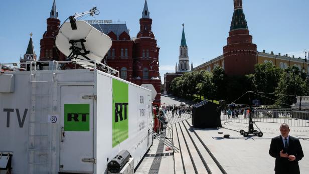Vehicles of Russian state-controlled broadcaster Russia Today are seen near the Red Square in central Moscow