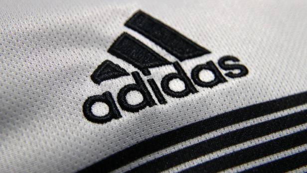 FILE PHOTO: An Adidas sign is seen before the company's annual news conference in Herzogenaurach