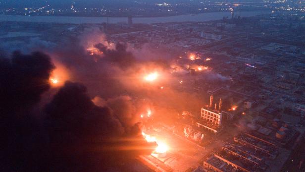 Smoke billows from fire following an explosion at the pesticide plant owned by Tianjiayi Chemical, in Xiangshui