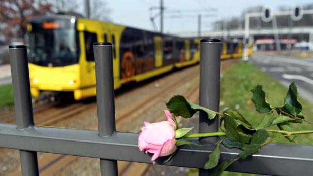Flowers are placed at the site of a shooting in Utrecht