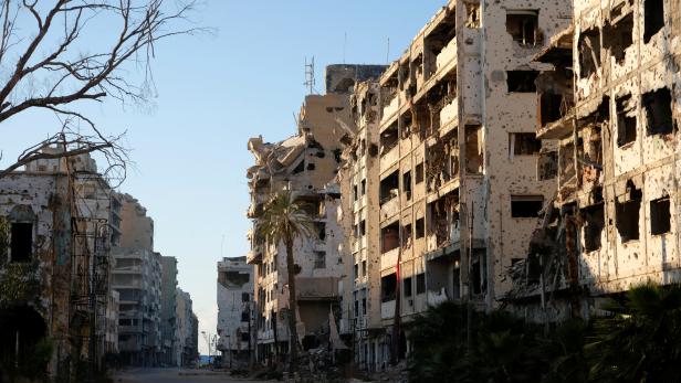 Damaged buildings from the war are seen in Benghazi