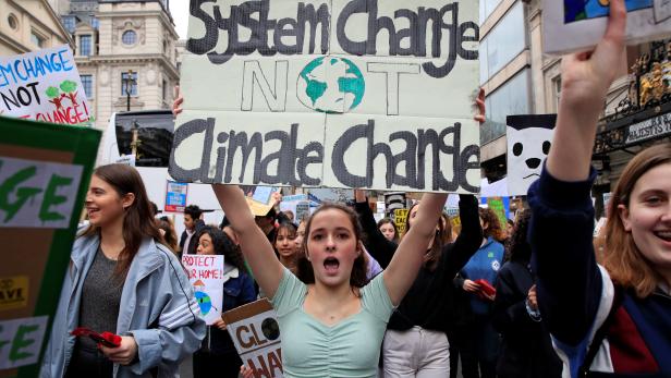 A demonstrator takes part in a protest against climate change in London