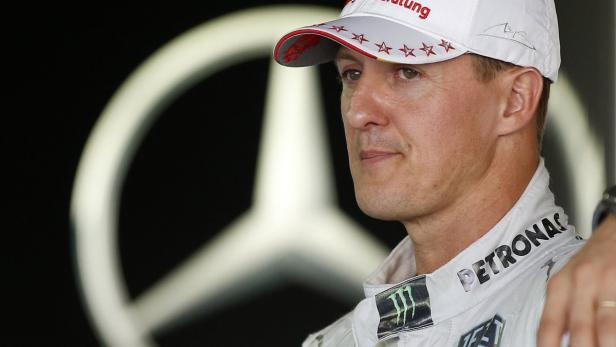 Mercedes Formula One driver Michael Schumacher of Germany stands in his garage at the Suzuka circuit October 4, 2012, ahead of Sunday&#039;s Japanese F1 Grand Prix. Seven-times world Formula One champion Michael Schumacher is to retire from the sport for a second time at the end of the season, the German driver told reporters ahead of the Japanese Grand Prix on Thursday. REUTERS/Toru Hanai (JAPAN - Tags: SPORT MOTORSPORT F1)