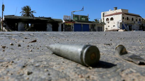FILE PHOTO: Shell casings are seen on the ground  during a fight between members of the Libyan internationally recognised government forces and Eastern forces in al-Yarmouk south of Tripoli