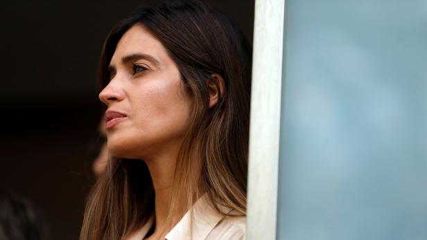 Sara Carbonero, wife of Spanish soccer player Iker Casillas, listens to her husband before they leave CUF Porto hospital in Porto