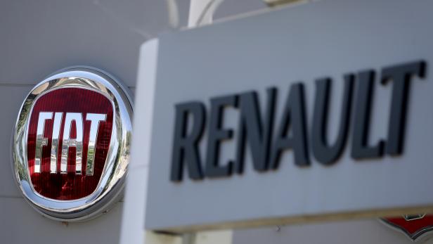 FILE PHOTO: The logos of Renault and Fiat carmakers are seen in Nice