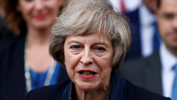 FILE PHOTO: Theresa May speaks to reporters after being confirmed as the leader of the Conservative Party and Britain's next Prime Minister  outside the Houses of Parliament in Westminster, central London
