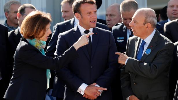French President Emmanuel Macron, French Defence Minister Florence Parly and Eric Trappier, Chairman and CEO of Dassault Aviation, attend the 53rd International Paris Air Show at Le Bourget