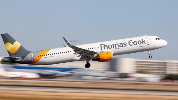 FILE PHOTO: A Thomas Cook Airbus A321 airplane takes off at the airport in Palma de Mallorca