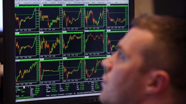 A trader works on the floor of the New York Stock Exchange after the closing bell, March 8, 2013. The Dow Jones industrial average hit yet another record high and the S&amp;P 500 has advanced to a level about 2 percent away from an all-time intraday high, as investors have seized the opportunity to buy on dips. REUTERS/Lucas Jackson (UNITED STATES - Tags: BUSINESS)