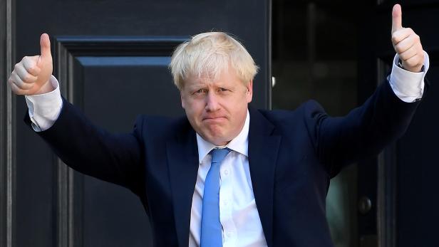 Boris Johnson arrives at the Conservative Party headquarters in London