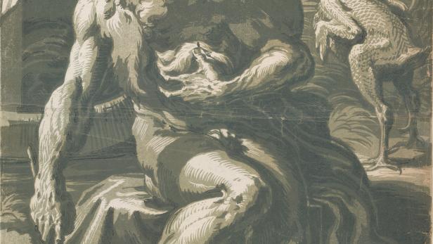 Ein bärtiger Mann sitzt mit einem Vogel und einem offenen Buch.