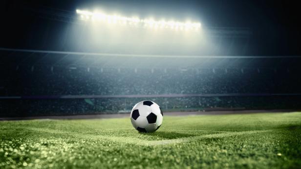 View of soccer ball on athletic field in stadium arena