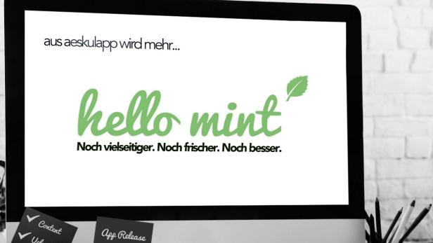 Ein Computerbildschirm zeigt das Logo „hello mint“ und den Slogan „Noch vielseitiger. Noch frischer. Noch besser.“.