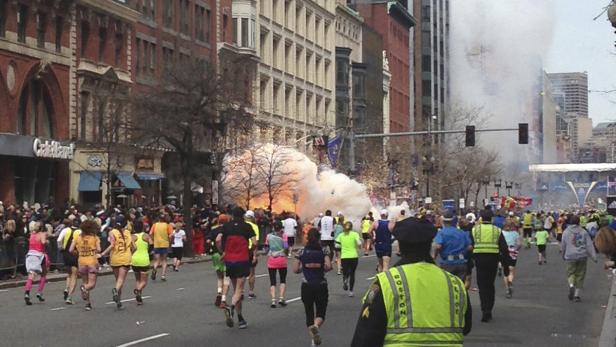 ATTENTION EDITORS - REUTERS PICTURE HIGHLIGHT TRANSMITTED BY 2342 GMT ON APRIL 15, 2013 WAS453 Runners continue to run towards the finish line of the Boston Marathon as an explosion erupts near the finish line of the race in this photo exclusively licensed to Reuters by photographer Dan Lampariello after he took the photo in Boston, Massachusetts. Mandatory Credit REUTERS/Dan Lampariello - REUTERS EXCLUSIVE REUTERS NEWS PICTURES HAS NOW MADE IT EASIER TO FIND THE BEST PHOTOS FROM THE MOST IMPORTANT STORIES AND TOP STANDALONES EACH DAY. Search for &quot;TPX&quot; in the IPTC Supplemental Category field or &quot;IMAGES OF THE DAY&quot; in the Caption field and you will find a selection of 80-100 of our daily Top Pictures. REUTERS NEWS PICTURES. TEMPLATE OUT