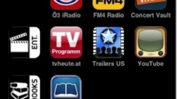 Ein iPhone-Homescreen mit verschiedenen App-Symbolen, darunter Musik, iTunes, Shazam und YouTube.