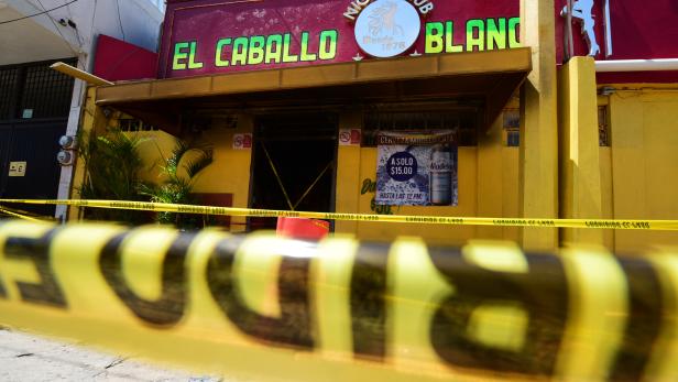 A general view shows "El Caballo Blanco" bar following a deadly arson attack by suspected gang members, in the southern Mexican port of Coatzacoalcos