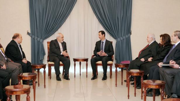 Der iranische Außenminister Mohammad Javad Zarif und der syrische Präsident Bashar al-Assad.