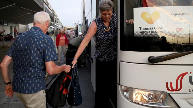 Thomas Cook customers arrive on bus at the airport of Heraklion, on the island of Crete