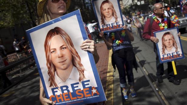 People hold signs calling for the release of impri People hold signs calling for the release of imprisoned wikileaks whistleblower Chelsea Manning while marching in a gay pride parade in San Francisco, California June 28, 2015. Manning has appealed to an Army court to overturn her court-martial conviction, a court filing released on Thursday said. REUTERS/Elijah Nouvelage/File Photo