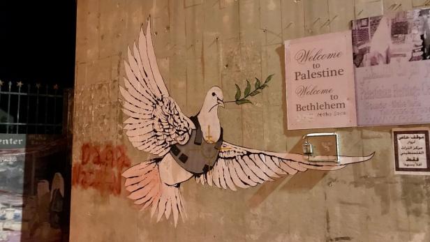 Die Friedenstaube mit Schusswetse von Banksy wurde zum Symbol Betlehems.