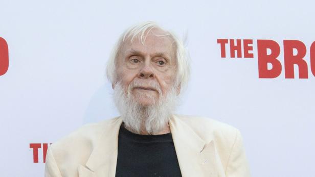 Conceptual artist Baldessari poses as he arrives for a dinner gala at The Broad Museum in Los Angeles