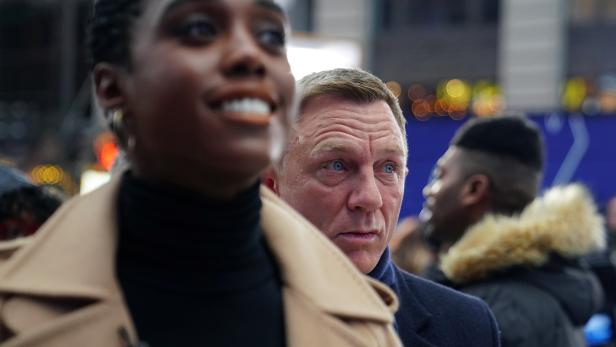 Actors Lashana Lynch and Daniel Craig attend a promotional event on TV in Times Square for the new James Bond movie "No Time to Die" in the Manhattan borough of New York City