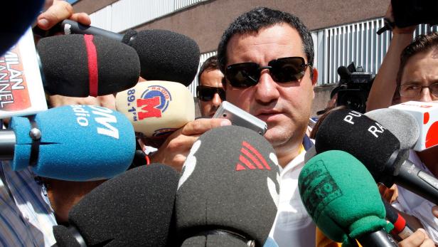 Soccer agent Mino Raiola speaks to the media as he arrives at FC Barcelona's office in Barcelona