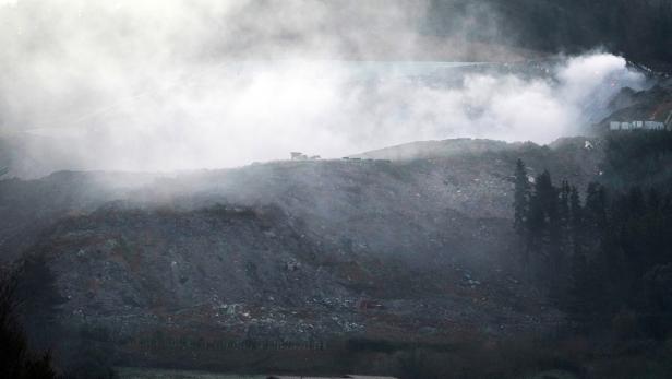 Smoke rises from a landfill site in Zaldibar which collapsed trapping two employees