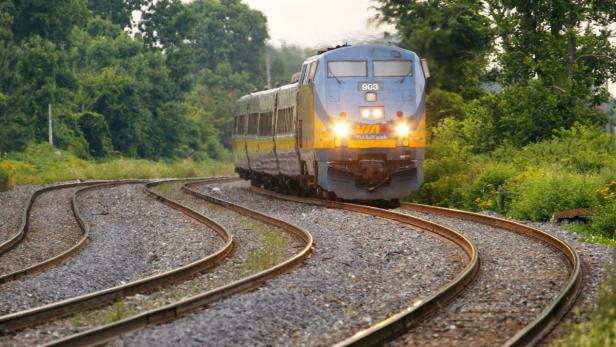 A Via Rail Canada passenger train pulls into Dorval Station in Montreal, in this July 22, 2009 file photo. Canadian police authorities said on Monday they had arrested and charged two men with an &quot;al Qaeda-supported&quot; plot to derail a passenger train. REUTERS/Shaun Best/Files (CANADA - Tags: BUSINESS POLITICS CRIME LAW)