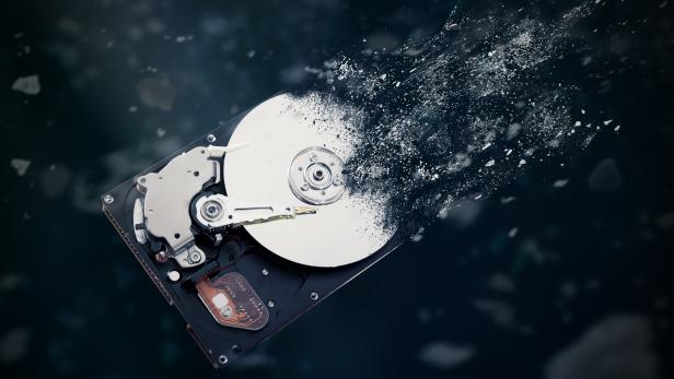 The old hard disk drive is disintegrating in space.