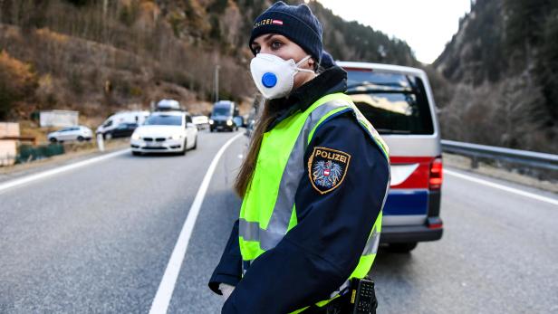 An Austrian police officer controls the traffic of Paznaun valley (Paznauntal), after the government announced a 14-day quarantine of the Paznaun valley and the St. Anton ski resort as cases of the coronavirus disease (COVID-19) appeared, in See