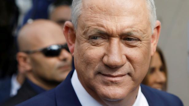 FILE PHOTO: Leader of Blue and White party, Benny Gantz looks on after voting at a polling station in Israel's national election in Rosh Ha'ayin, Israel