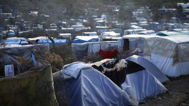 FILE PHOTO: A view of a makeshift camp for refugees and migrants next to the Moria camp, on the island of Lesbos