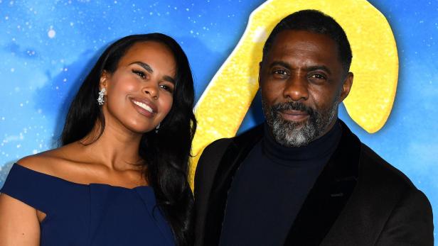 Idris Elba posiert mit seiner Frau Sabrina Dhowre Elba auf einem roten Teppich.