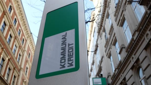 The logo of Kommunalkredit is pictured in front of its headquarters building in Vienna, March 5, 2012. Nationalised Austrian lender Kommunalkredit could need as much as one billion euros ($1.3 billion) as it tries to address its exposure to Greece, the country&#039;s finance minister told Austrian radio on Saturday. REUTERS/Heinz-Peter Bader (AUSTRIA - Tags: BUSINESS LOGO)