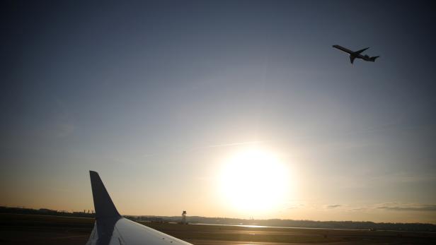 An airplane takes off from the Ronald Reagan National Airport as air traffic is affected by the spread of the coronavirus disease (COVID-19), in Washington