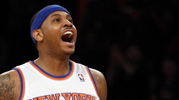 New York Knicks forward Carmelo Anthony reacts after hitting a three-point shot against the Boston Celtics in the first quarter of Game 1 of their NBA Eastern Conference Quarterfinals basketball playoff series in New York, April 20, 2013. REUTERS/Adam Hunger (UNITED STATES - Tags: SPORT BASKETBALL)