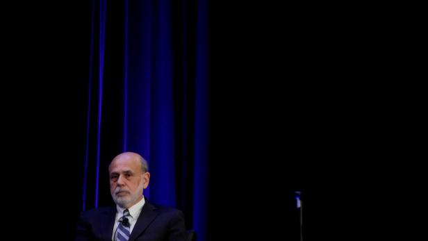 FILE PHOTO: Former Federal Reserve Chairman Ben Bernanke prepares to speak during a panel discussion in Atlanta