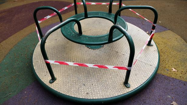 A children's merry-go-round is seen cordoned off during lockdown amid the coronavirus disease (COVID-19) outbreak, in Madrid
