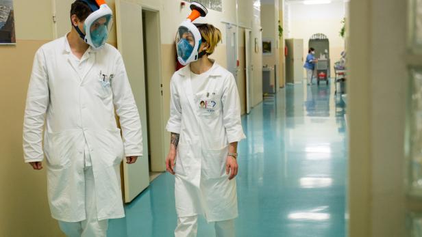 Medical workers from Motol hospital wear snorkel masks transformed into high-grade protection in Prague