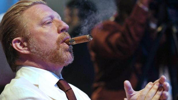 epa03607728 Former German tennis player Boris Becker smokes a cigar during the closing ceremony of the 15th Cuban Havana Cigar Festival in Havana, Cuba, late 02 March 2013. Becker arrived in Cuba on 28 February and was the festival&#039;s guest of honour. EPA/STRINGER