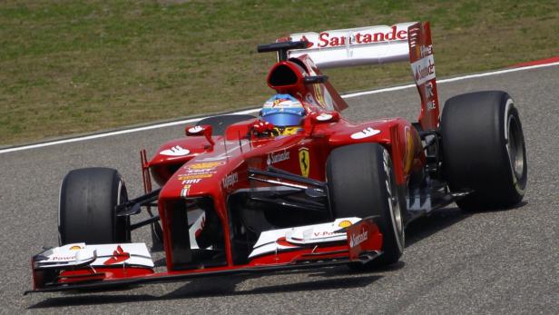 Ferrari Formula One driver Fernando Alonso of Spain drives during the third practice session of the Chinese F1 Grand Prix at the Shanghai International Circuit, April 13, 2013. REUTERS/Petar Kujundzic (CHINA - Tags: SPORT MOTORSPORT F1)