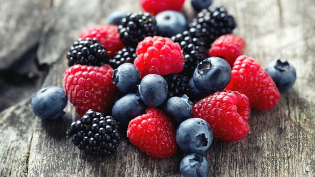 summer berries on wooden surface