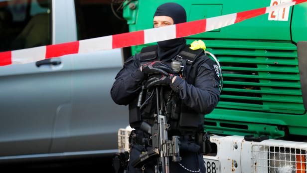 German special police guards the entrance of the El-Irschad centre in Berlin
