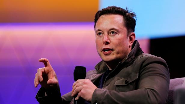 FILE PHOTO: Tesla CEO Elon Musk gestures during a conversation at the E3 gaming convention in Los Angeles