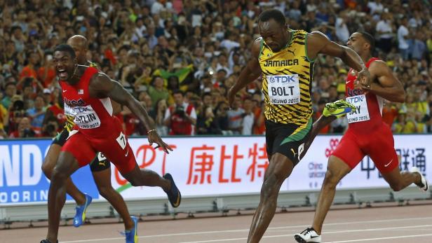 Usain Bolt läuft bei einem Leichtathletik-Wettkampf in Peking gegen Justin Gatlin und Trayvon Bromell.