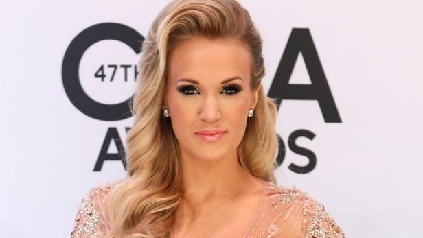 File photo of Carrie Underwood posing on arrival a